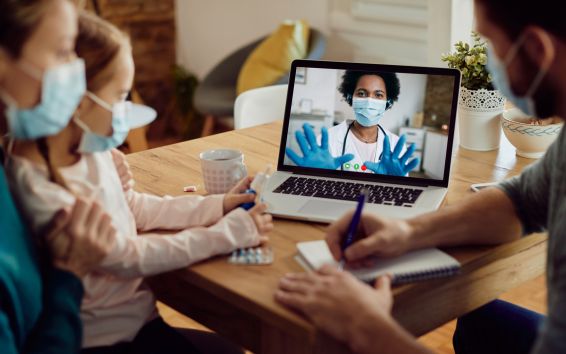 whole family use telemedicine from laptop