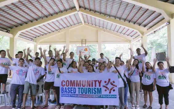 CBT participants showcase the community-focused aspect of the program as they join the locals for a picture.